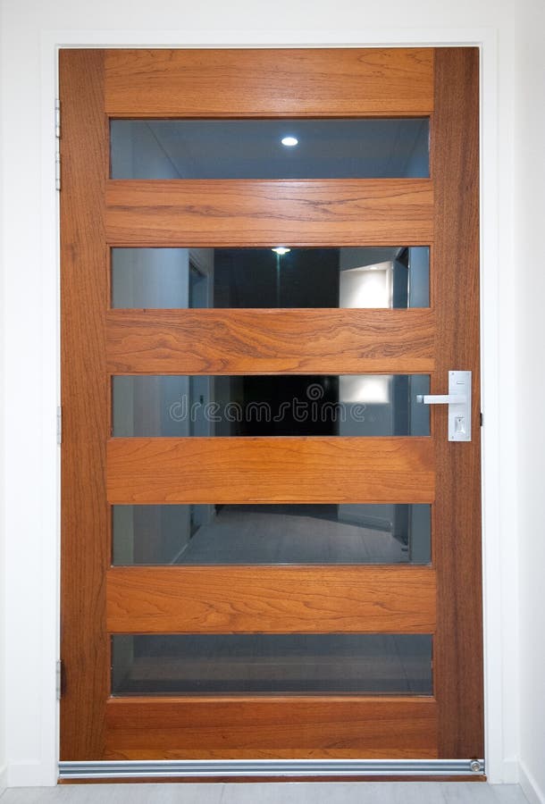 Modern House - Wooden Front Door. With reflections stock image